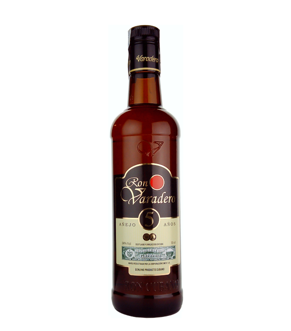Ron Varadero Aejo 5 Aos Rhum, 70 cl, 38 % Vol. (Rum), Kuba, Ron Varadero has been distilled in Cuba since 1862, according to the old tradition, exclusively from the best sugar cane grown on the island and stored for a long time in oak barrels in Cuba`s special, warm, humid climate.   This is how it gets its unmistakable character, its typical note and its excellent quality, which is appreciated by connoisseurs all over the world.  The Ron Varadero Aejo 5 Aos Rhum matures at least five years in oak barrels, which give it its light golden color and delic